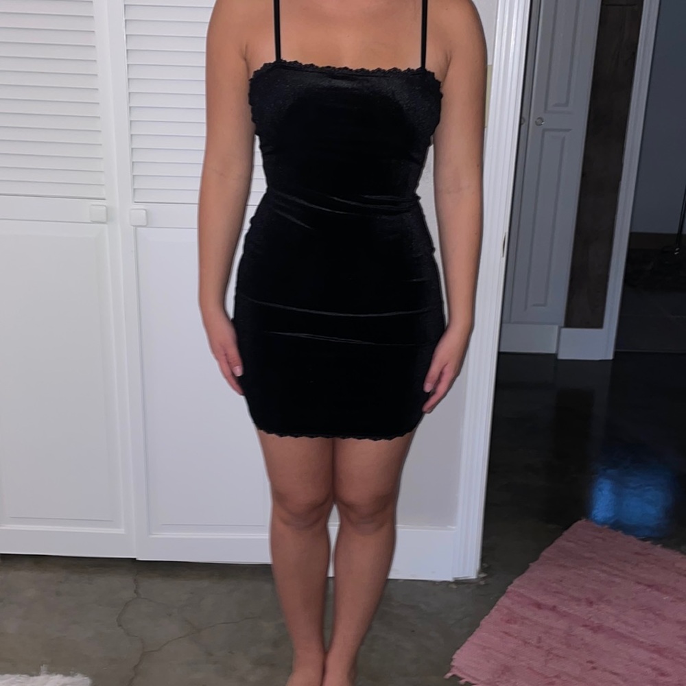 Black velvet dress with fringe on top and bottom